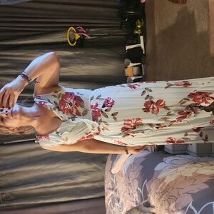 light teal and floral dress says size xxs but fits like a small  very pretty